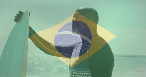 Surfer Holding Board at Brazilian Shoreline