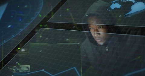 Man Analyzing Holographic Data on Laptop in Dark Environment