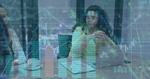 Business Professionals Analyzing Financial Growth Graphs with Digital Overlay