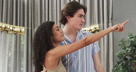 Happy Couple Planning Birthday Celebration at Home