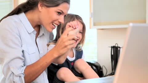 Mother and Daughter Video Calling in Bright Kitchen
