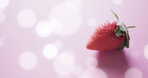 Fresh Strawberry on Pink Background with Soft Lights