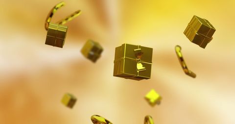 Floating gold presents and candy canes on festive golden background