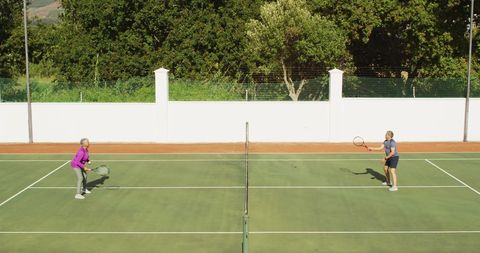 Happy Senior Couple Enjoying Tennis Outdoors Under Sunny Sky - Download Free Stock Images Pikwizard.com