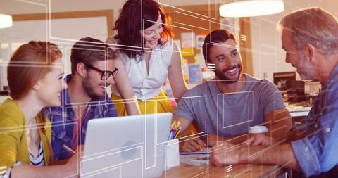 Multigenerational Team Collaborating on Creative Project in Open Office