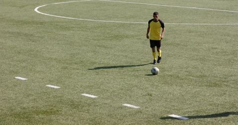 Young Soccer Player Engaging Intensely in Football Match