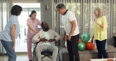 Diverse Group Welcoming New Patient into Physiotherapy Session