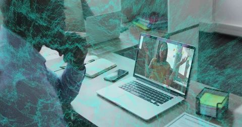 Colleague discussing problem over online video call in office environment