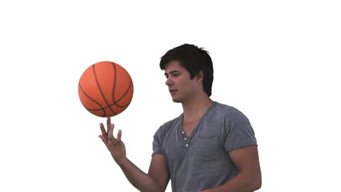 Man Skillfully Spinning Basketball on Finger