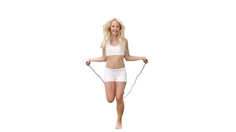 Woman Skipping Rope in Exercise Attire