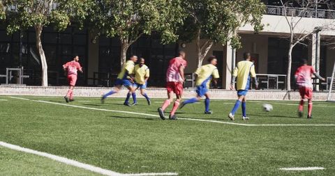 Youth soccer game in action with vibrant green field