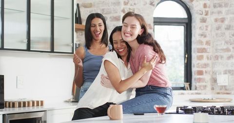Joyful Friends Celebrating Engagement Over Morning Tea