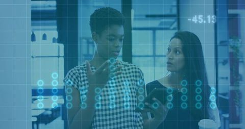 Professional Women Collaborating Over Interactive Data Visualization on Mobile Device