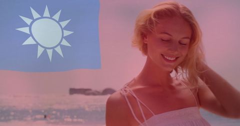 Smiling Woman Enjoying Sunny Beach with Taiwan Flag Symbolism