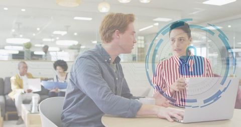 Coworkers Collaborating in Modern Workspace with Cybersecurity Concept