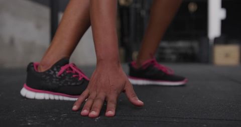 Woman in Athletic Pose Preparing for Workout