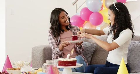 African American Friends Enjoying Cake Celebration at Home