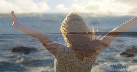 Carefree Woman Enjoying Coastal Freedom on a Sunny Day - Download Free Stock Images Pikwizard.com