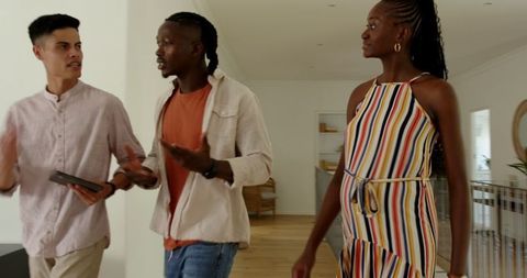 Friendly conversation with estate agent in modern living space