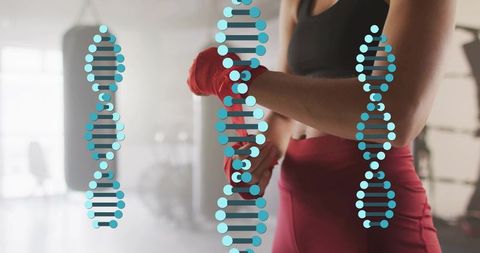Athlete wrapping hands by heavy bag with dna helix overlay representing fitness genetics