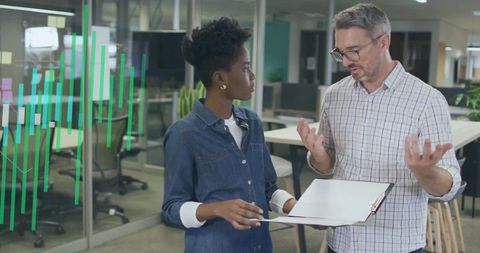 Diverse Professionals Discussing Data Innovation in Open Office