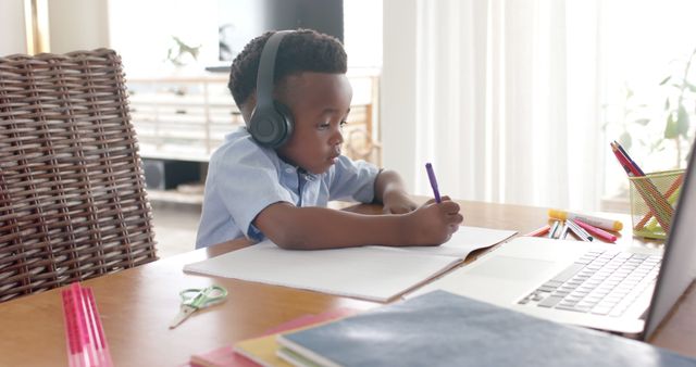 Focused African American Boy Learning Online with Laptop at Home - Download Free Stock Images Pikwizard.com