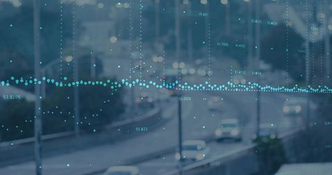 Overlaying teal dotted waveform across urban highway at dusk showing data points