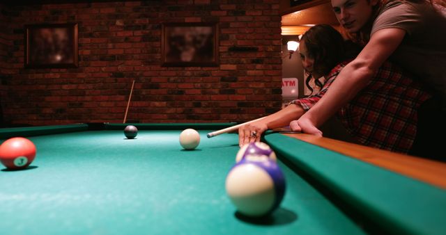 Couple Playing Pool Game in Cozy Billiard Room - Download Free Stock Images Pikwizard.com