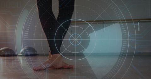 Bare feet ballet balance at barre with futuristic hud overlay for dance training
