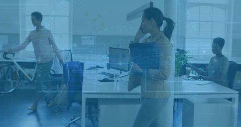 Asian Woman Communicating in Modern High-Tech Office Environment