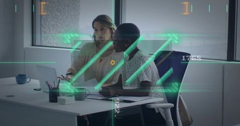Colleagues collaborating over laptop with augmented reality HUD overlay in modern office