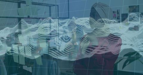 Diverse women collaborating around glass wall with post-its and digital data wave overlay
