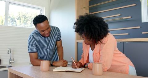 Couple Sharing Happy Moments in Modern Kitchen