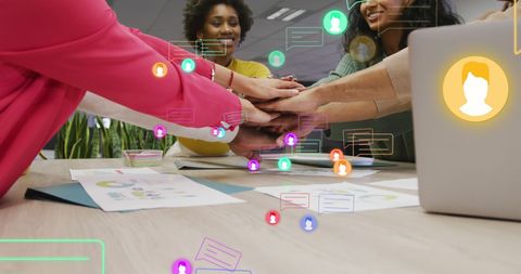 Diverse office team celebrating successful collaboration