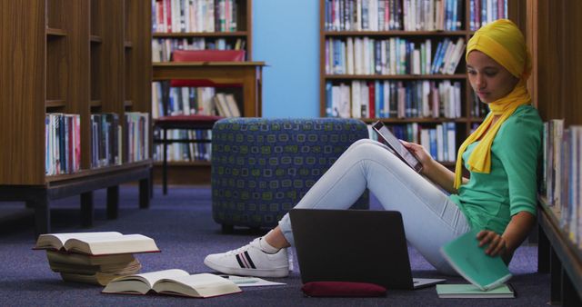 Woman Studying in Library with Laptop and Books - Download Free Stock Images Pikwizard.com