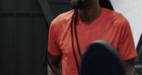 Athlete training in gym holding racket