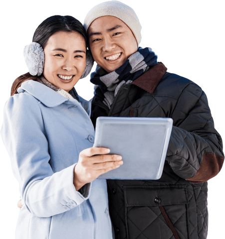 Happy couple in winter clothes with tablet on transparent background