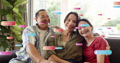 Multigenerational family sharing couch and displaying colorful social media badge overlays