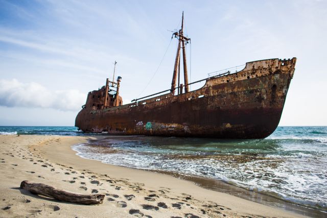 Rustic Abandoned Shipwreck on Sandy Beach - Download Free Stock Photos Pikwizard.com