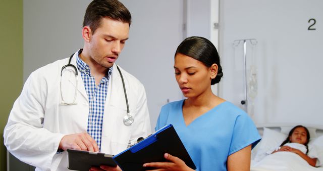 Healthcare Professionals Reviewing Patient Data in Hospital Room - Download Free Stock Images Pikwizard.com