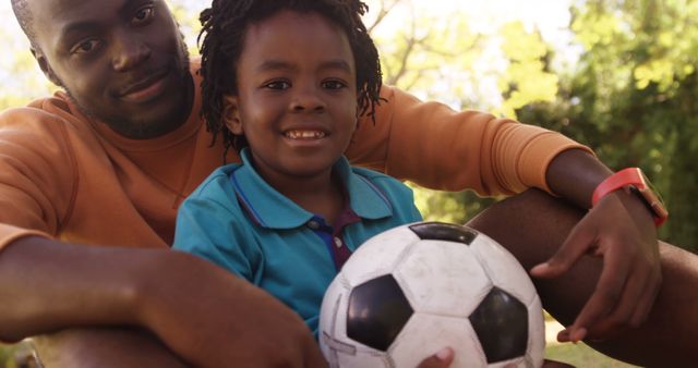 Father and son bonding playing soccer outdoors - Download Free Stock Images Pikwizard.com