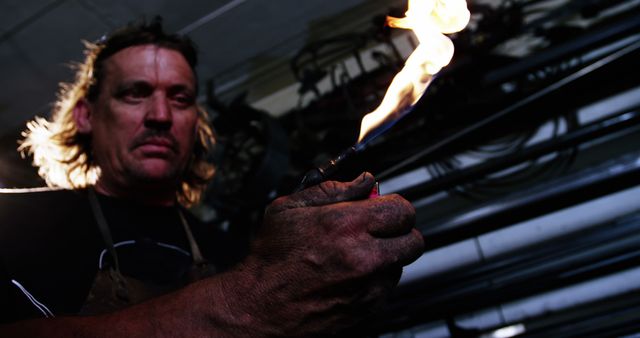 Man Welding With Torch Wearing Safety Gear in Workshop - Download Free Stock Images Pikwizard.com