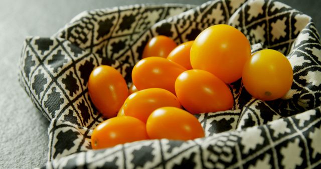 Fresh Orange Tomatoes in Black and White Patterned Cloth - Download Free Stock Images Pikwizard.com