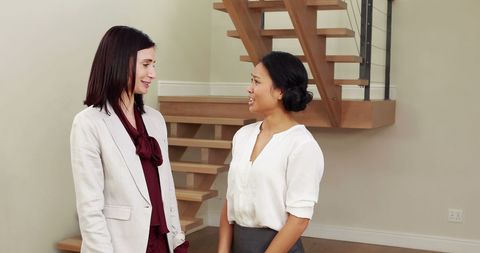 Diverse Businesswomen Talking Together in Modern Office