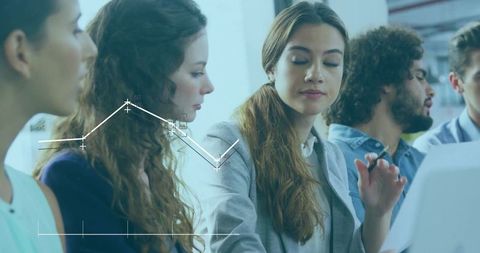 Diverse Team Analyzing Data with Digital Overlay in Modern Meeting