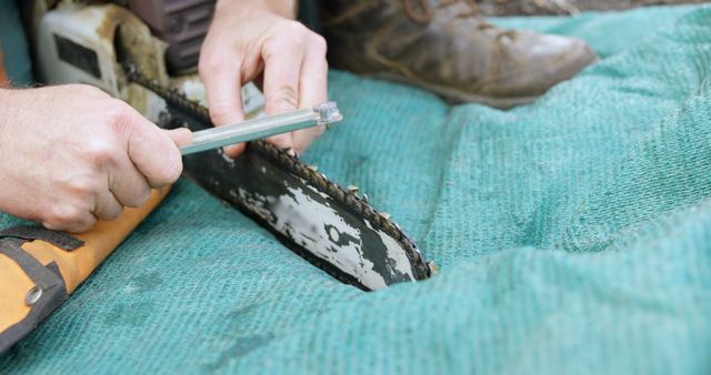 Person Sharpening Chainsaw Blade Outdoors - Download Free Stock Images Pikwizard.com