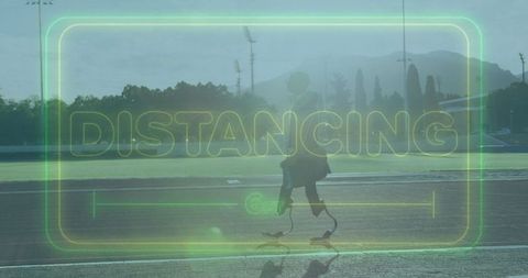 Prosthetic Athlete Sprinting on Outdoor Track with Distancing Message
