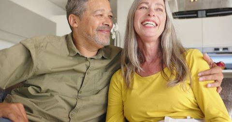 Senior Couple Relaxing in Cozy Modern Kitchen-Living Space
