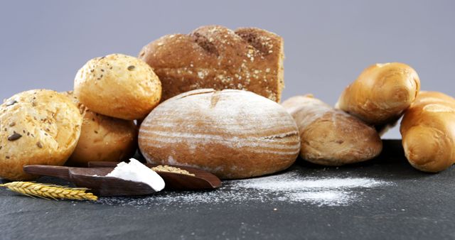 Assorted Freshly Baked Breads on Rustic Table - Download Free Stock Images Pikwizard.com