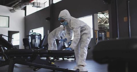 Sanitation Workers Disinfecting Gym for Health and Safety